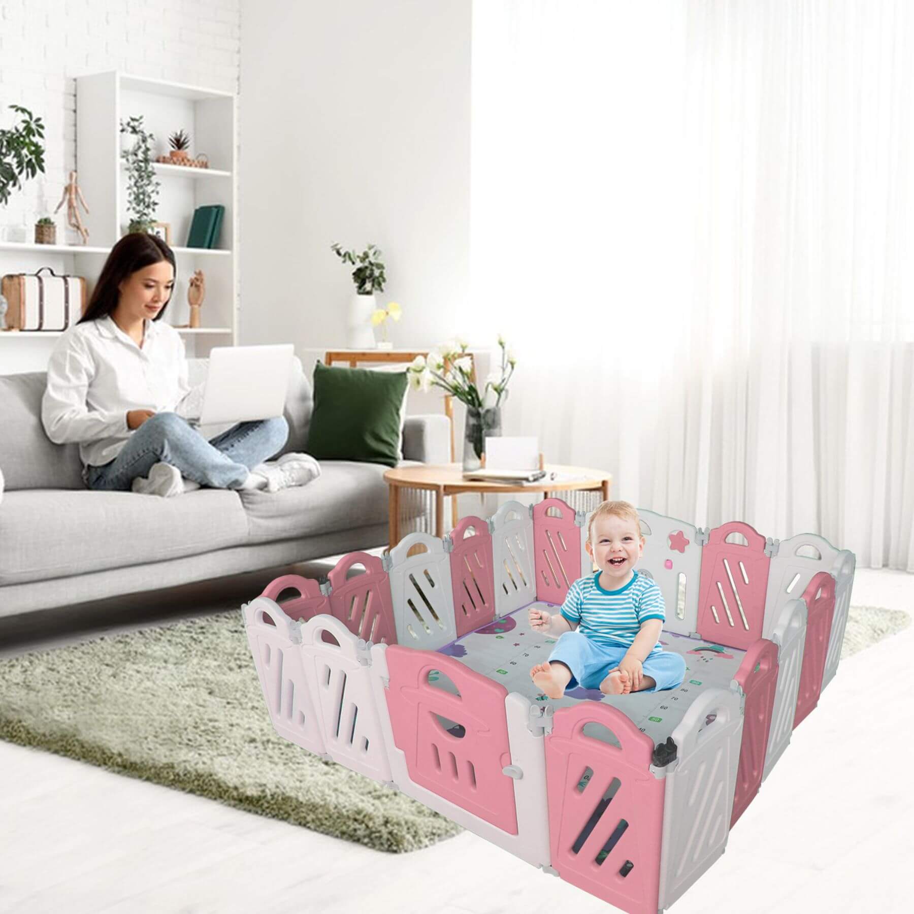 Child in MGSPORT 16+2 Panel Foldable Baby Playpen, Pink + White with a woman sitting on a couch in a living room.
