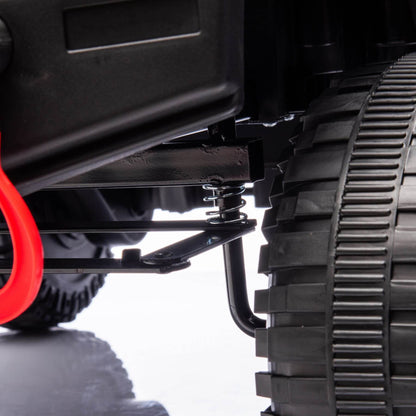 Close-up of a vehicle's suspension system with a black tire and red wheel well on a white background.