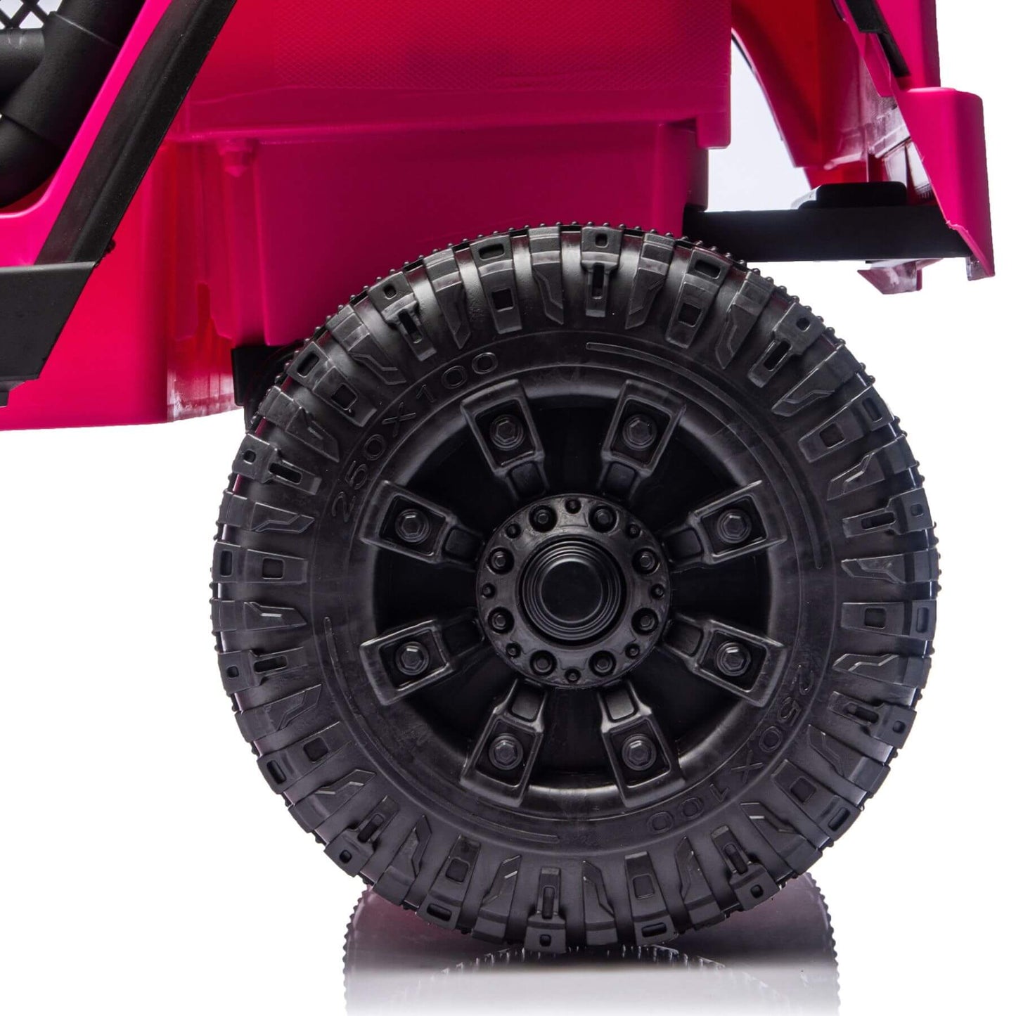 Close-up of a pink toy car with a black tire on a white background