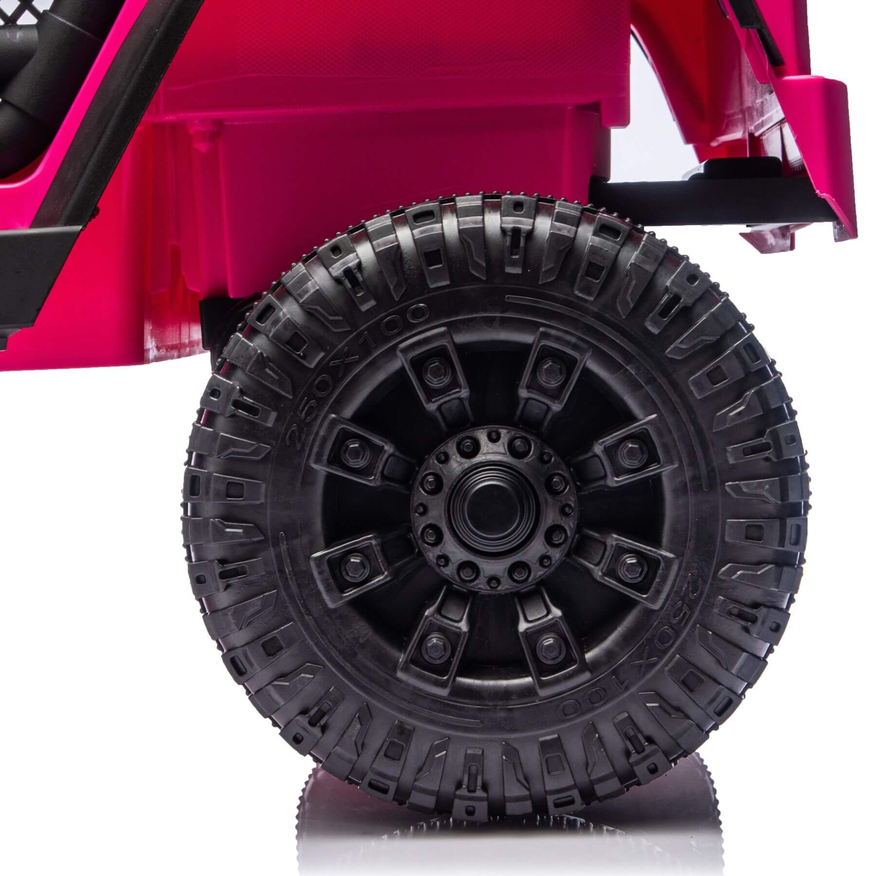 Close-up of a pink toy car with a black tire on a white background