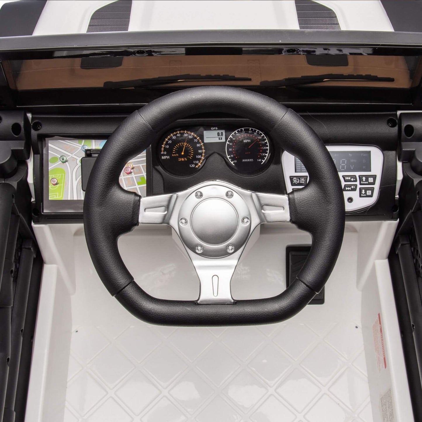 Steering wheel and dashboard of a vehicle with a black and white interior.