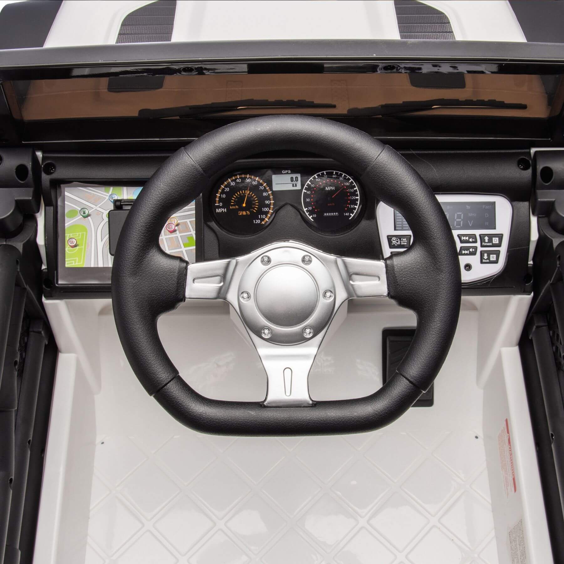 Steering wheel and dashboard of a vehicle with a black and white interior.