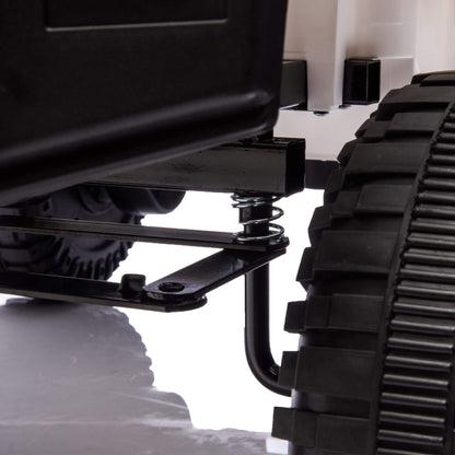 Close-up of a black tracked vehicle on a white background