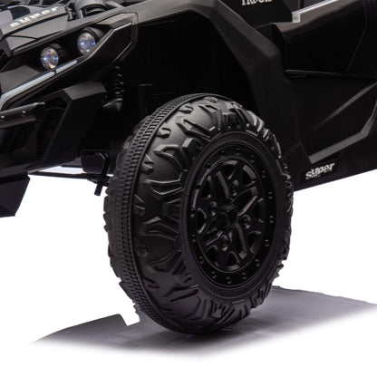 Close-up of a black off-road vehicle tire with tread pattern on a white background