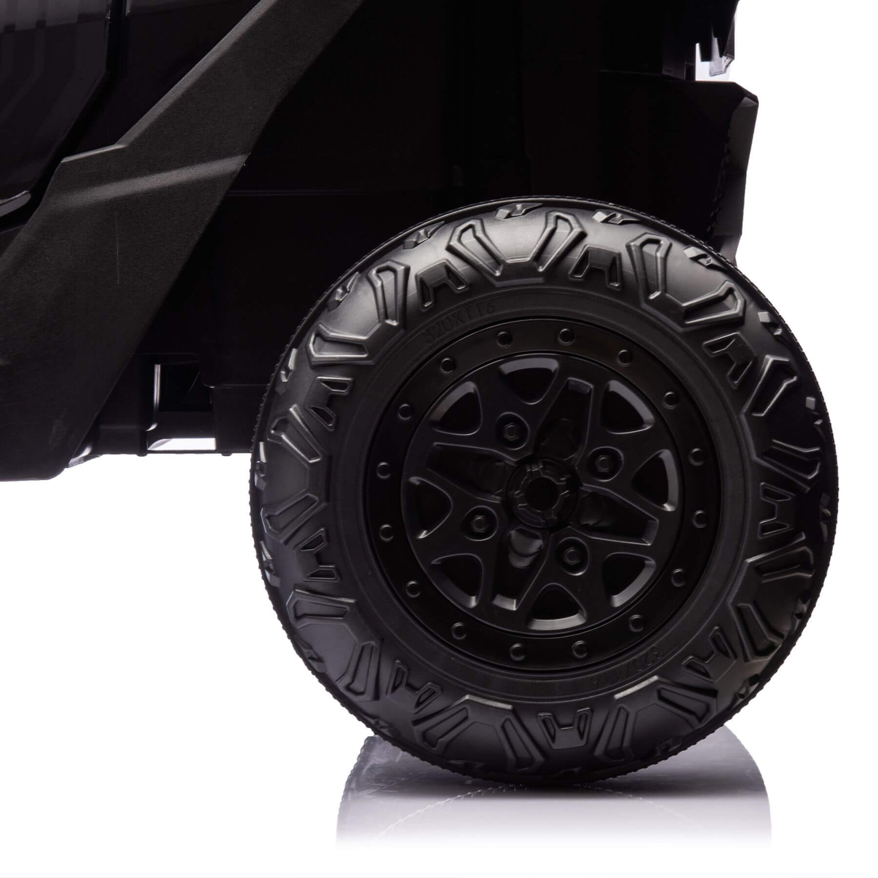 Black off-road vehicle tire with detailed tread pattern on a white background