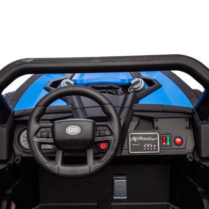 Steering wheel and dashboard of a blue off-road vehicle with visible brand logo.