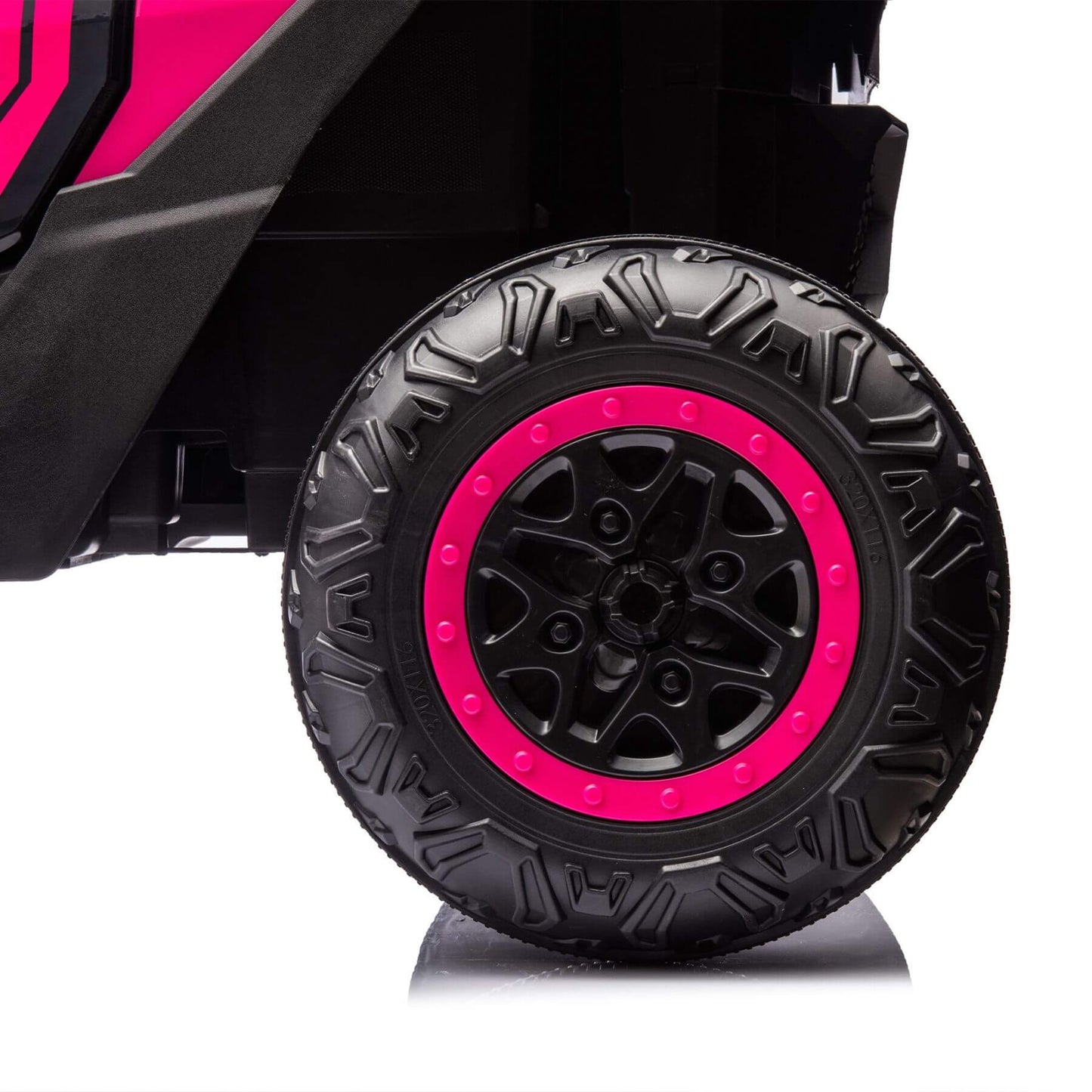 Close-up of a black tire with pink rim on a white background