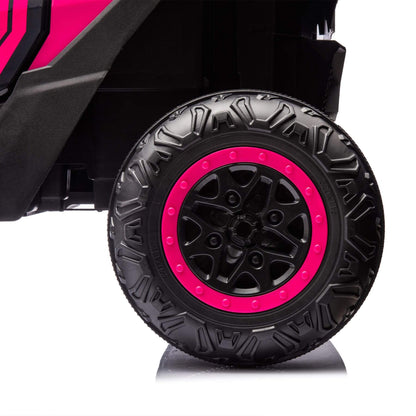 Close-up of a black tire with pink rim on a white background