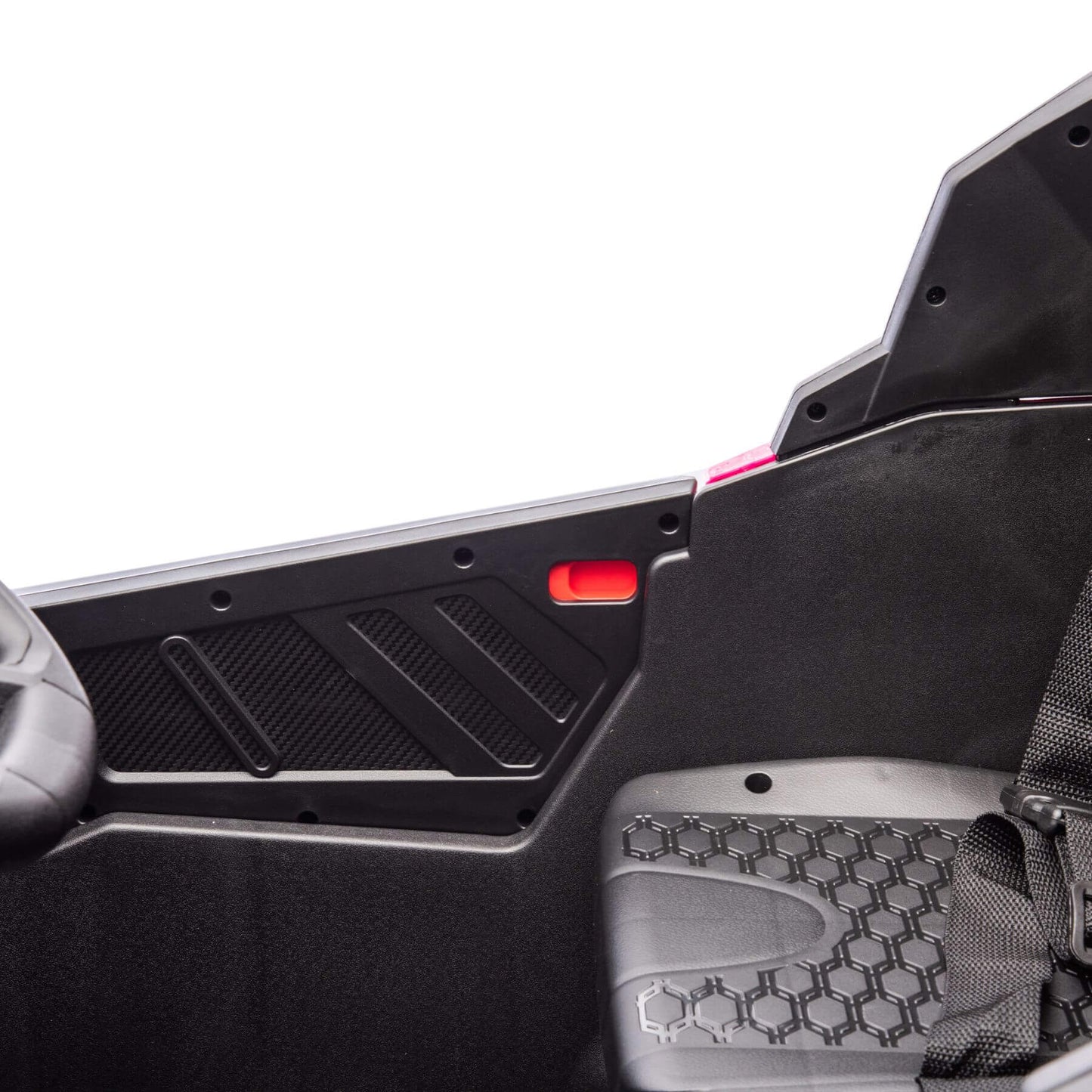 Close-up of a car's interior with a focus on the floor mat and door panel.