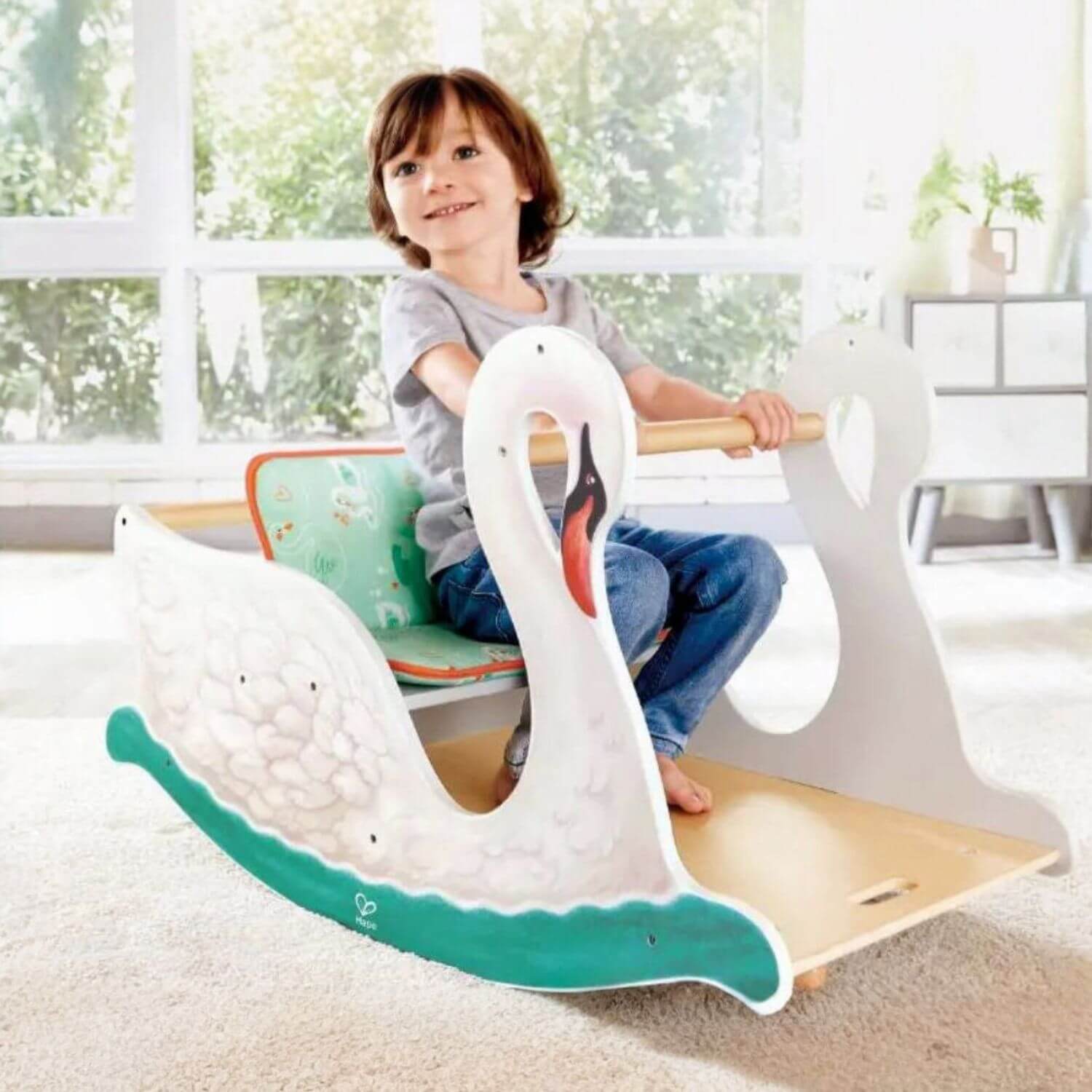 Boy Sitting on Hape 2-in-1 Swan Seat