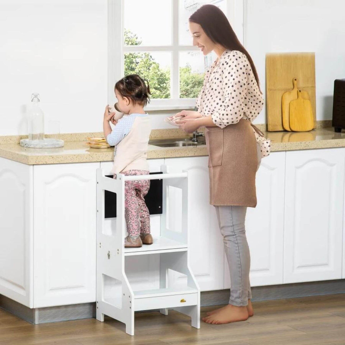 Kid Standing on Qaba 2-in-1 Kitchen Table Set Toddler Standing Tower