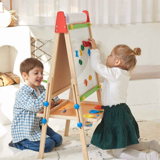 Two children playing with Tiny Land® 3-in-1 Art Easel & Paper Roll Set in a home setting.