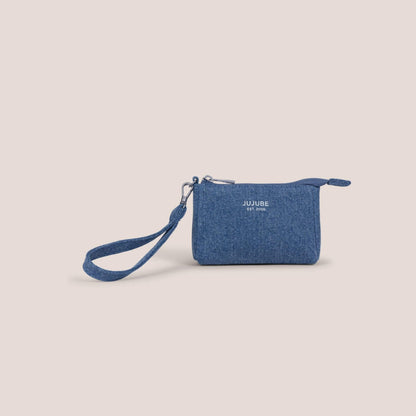 Blue pouch with a strap on a beige background, featuring the JuJuBe brand.