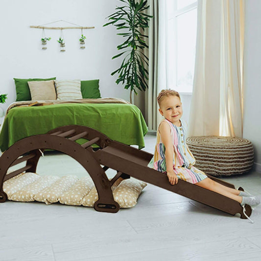 Child on Goodevas 3in1 Montessori Climbing Set with green bedding and a bed.