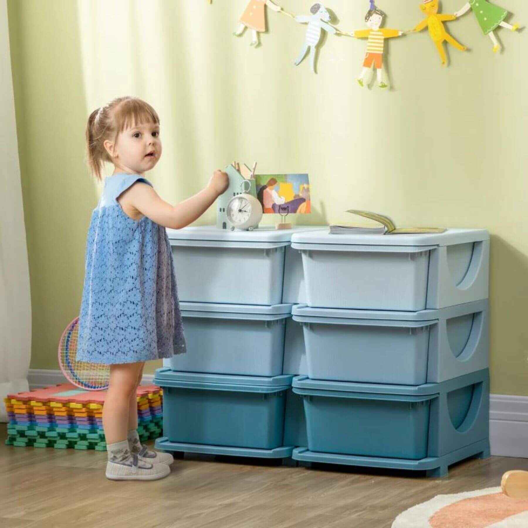 Girl Standing next to Qaba 3 Tier Kids Storage Unit, 6 Drawer Chest, Plastic Bins for Kids Bedroom Blue