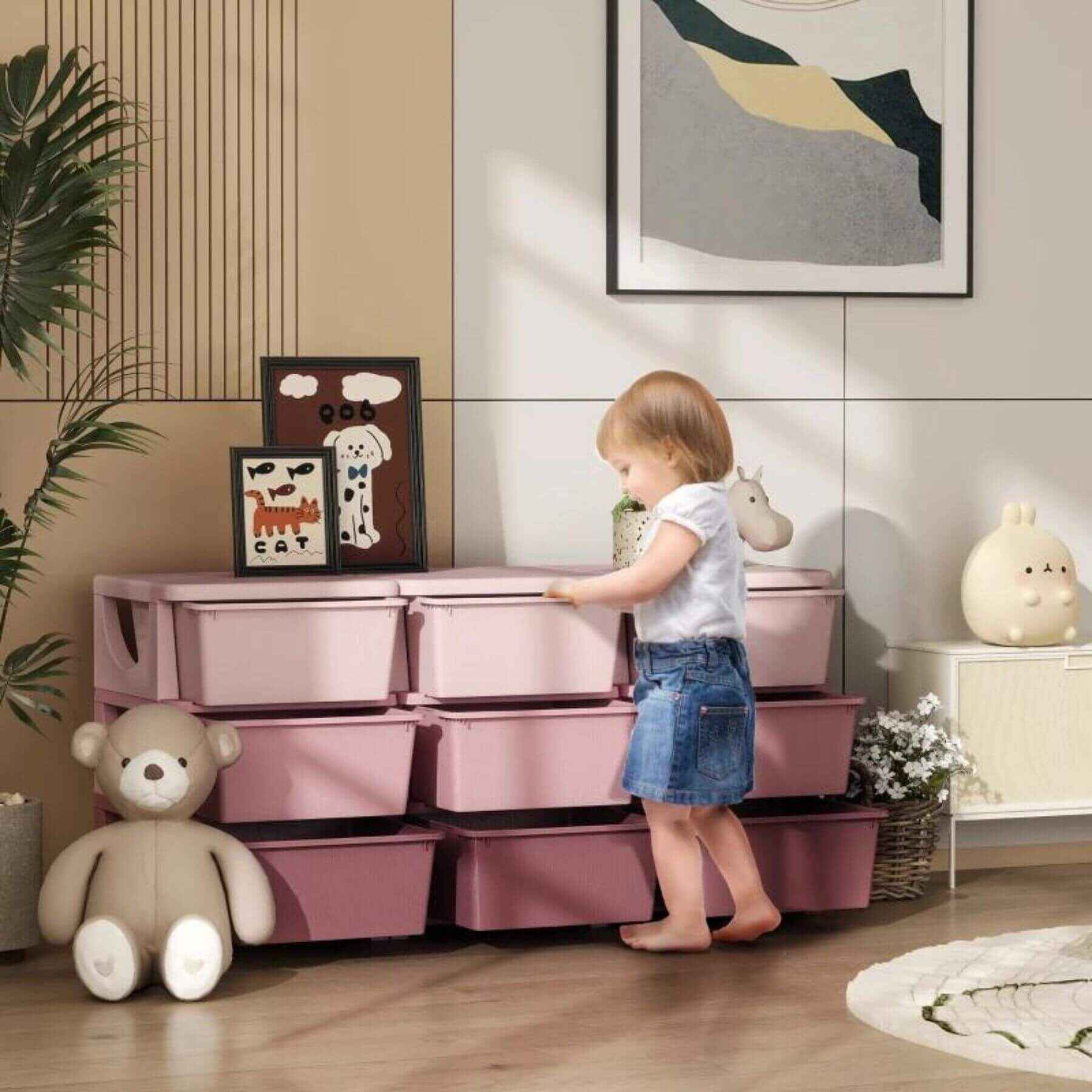 Girl Getting Stuff From the Drawer of Qaba 29.5" 3 Tier Kids Storage Unit Dresser Tower w/ 9 Drawers Pink