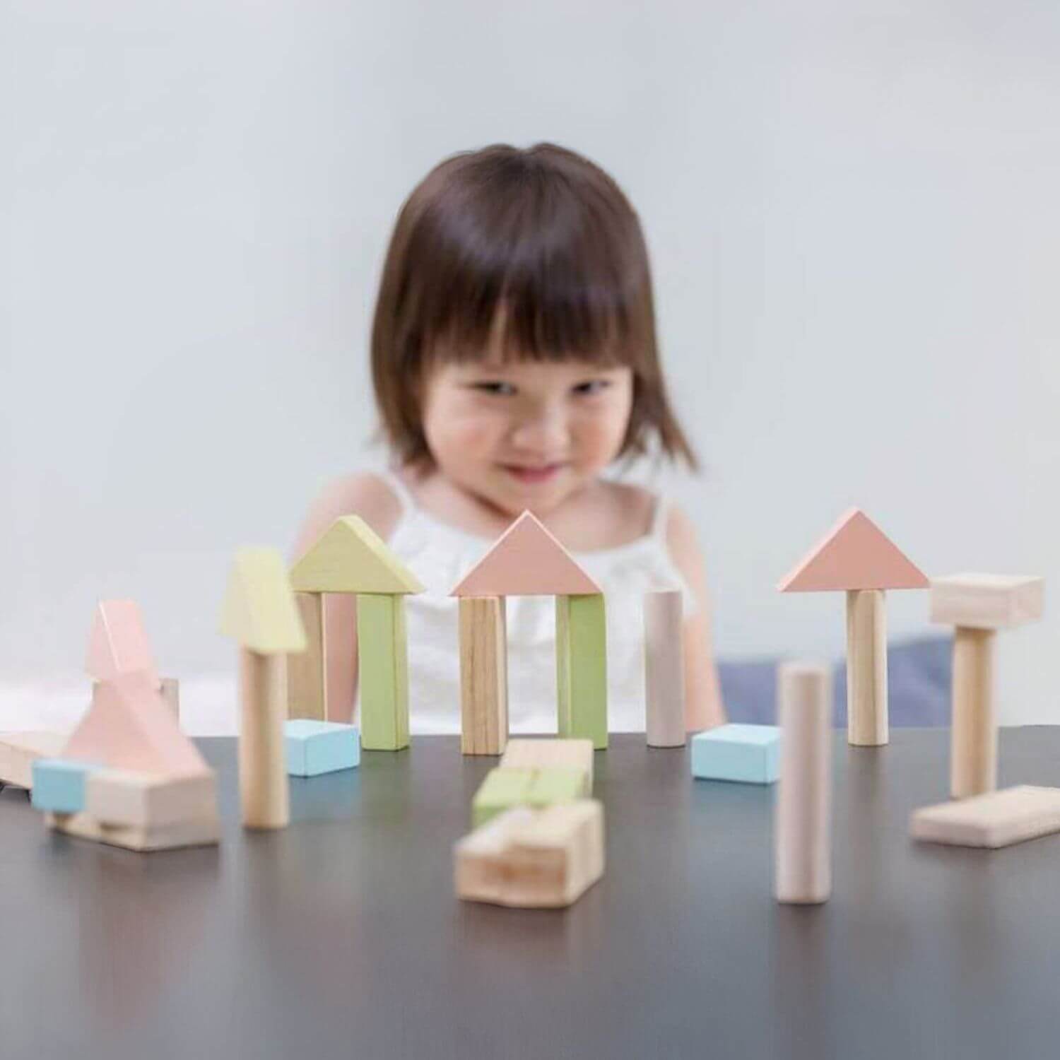 Girl Playing PlanToys 40 Unit Blocks