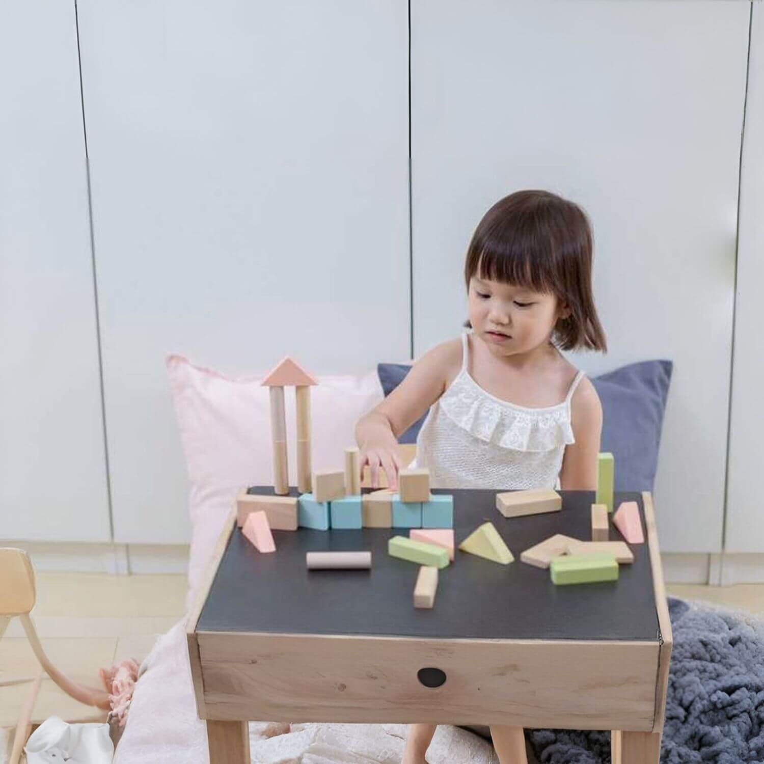 Girl Playing PlanToys 40 Unit Blocks