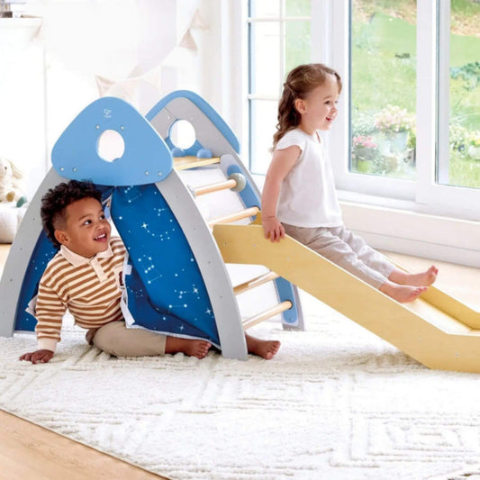 Two children playing on Hape 4-in-1 Climb 'n' Slide Gym Set