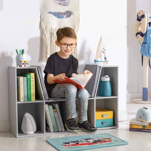 Boy Sitting at HOMCOM 6-Cubby Kids Bookcase with Reading Nook and Cushion Grey