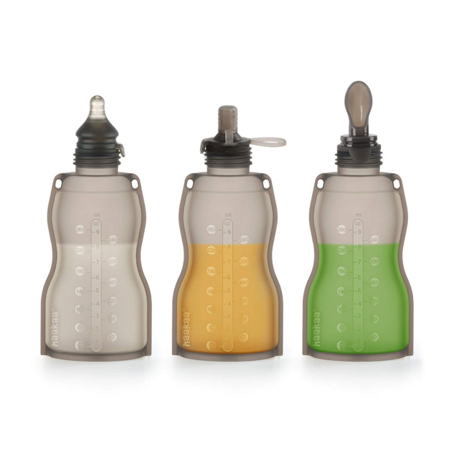 Three Haakaa Silicone Milk Storage Bag 9oz with different colored liquids on a white background