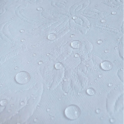 A close-up of AFG Laminated 2" Waterproof Mini Crib Mattress