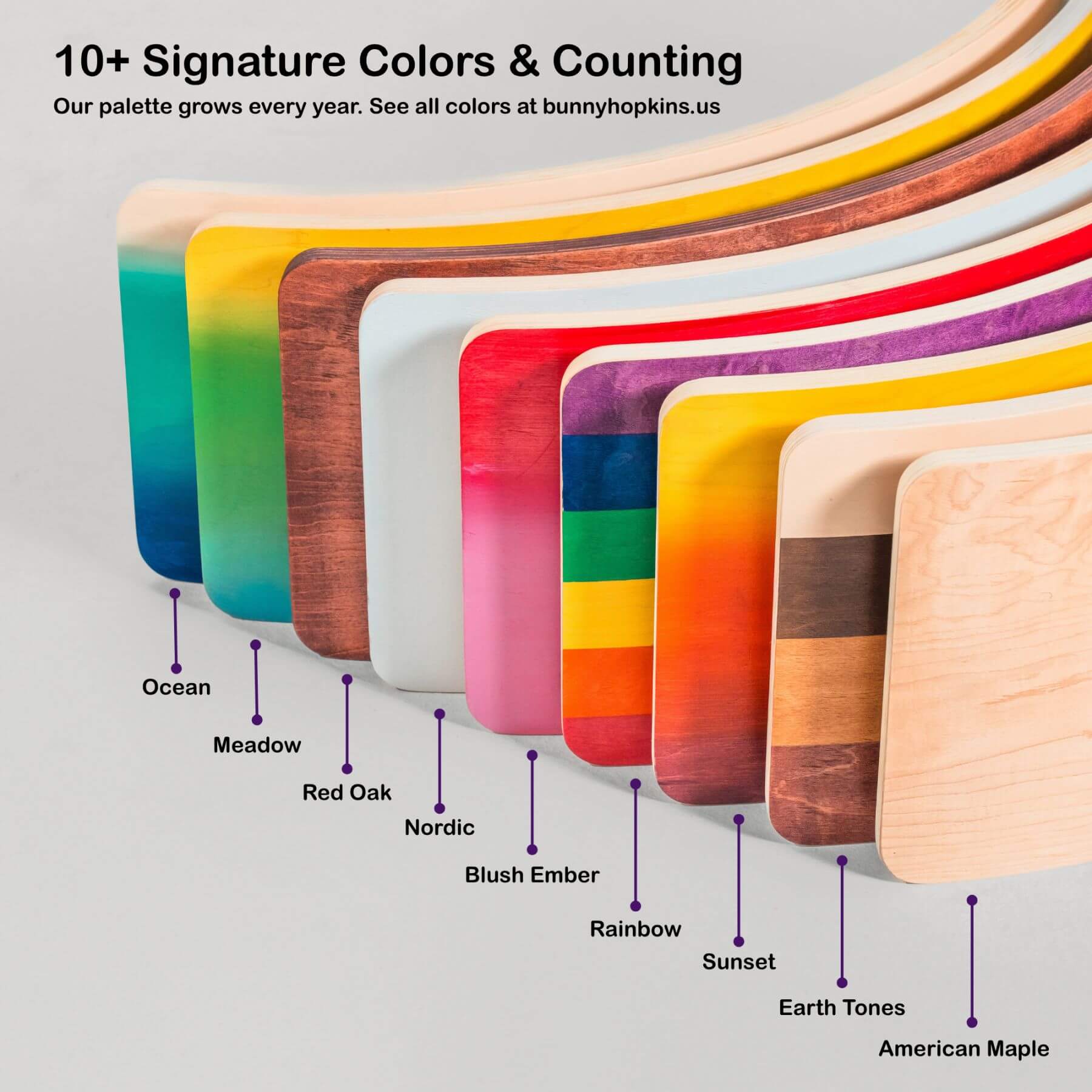 Colorful wooden balance boards with labeled colors on a gray background