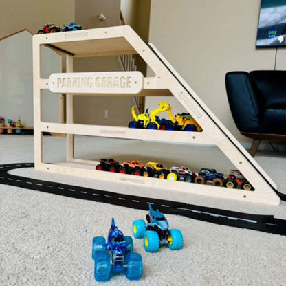 Wooden toy garage with toy cars and a track in a room setting