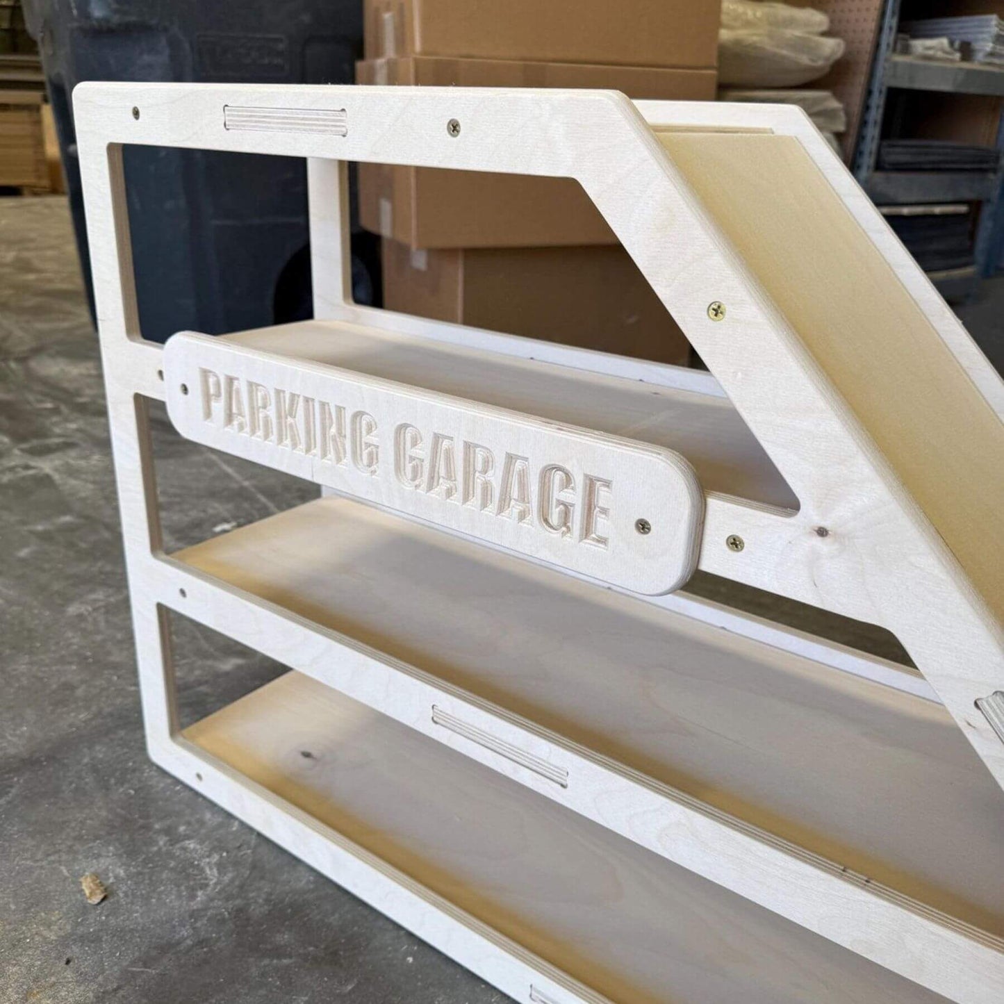 CAMDEN- Toy Car Storage + Ramp in a warehouse setting