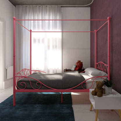 DHP Canopy Metal Bed Twin - Pink in a bedroom with a teddy bear and plant on a nightstand.