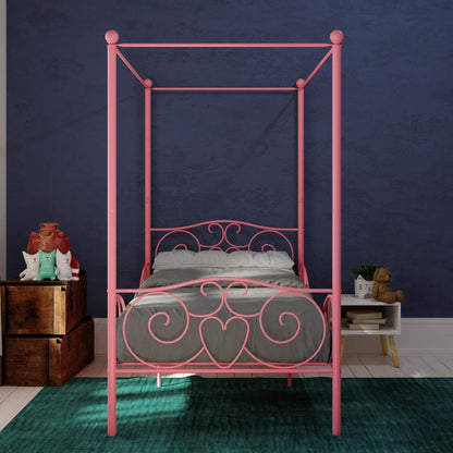DHP Canopy Metal Bed Twin - Pink in a room with a dark blue wall.