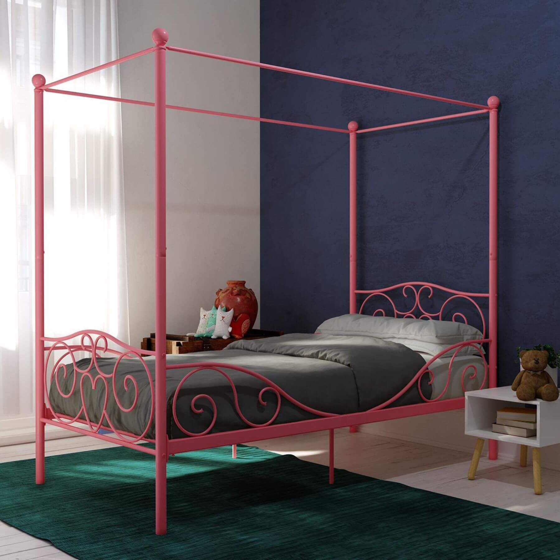 DHP Canopy Metal Bed Twin - Pink in a room with a blue wall and white curtains.