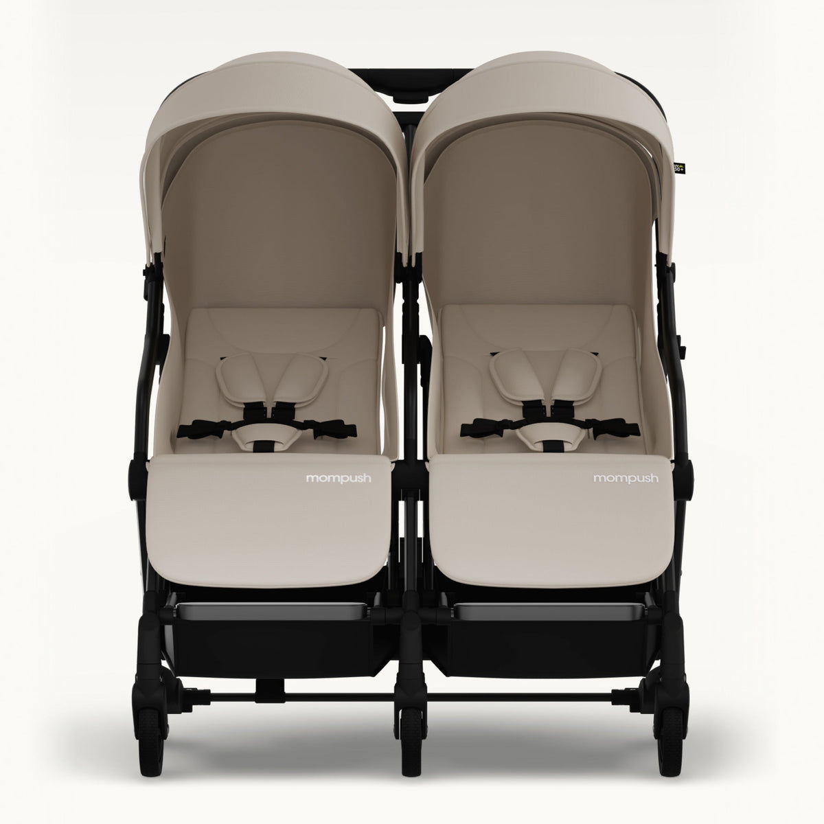 A front-facing view of a double stroller with two beige seats and canopies, a black frame, and black wheels, set against a plain light background.