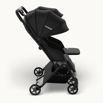 A black double stroller with a large adjustable canopy, side pocket, and four wheels, shown from a three-quarters angle on a light gray background. The brand name 'monopuai' is visible on the canopy.