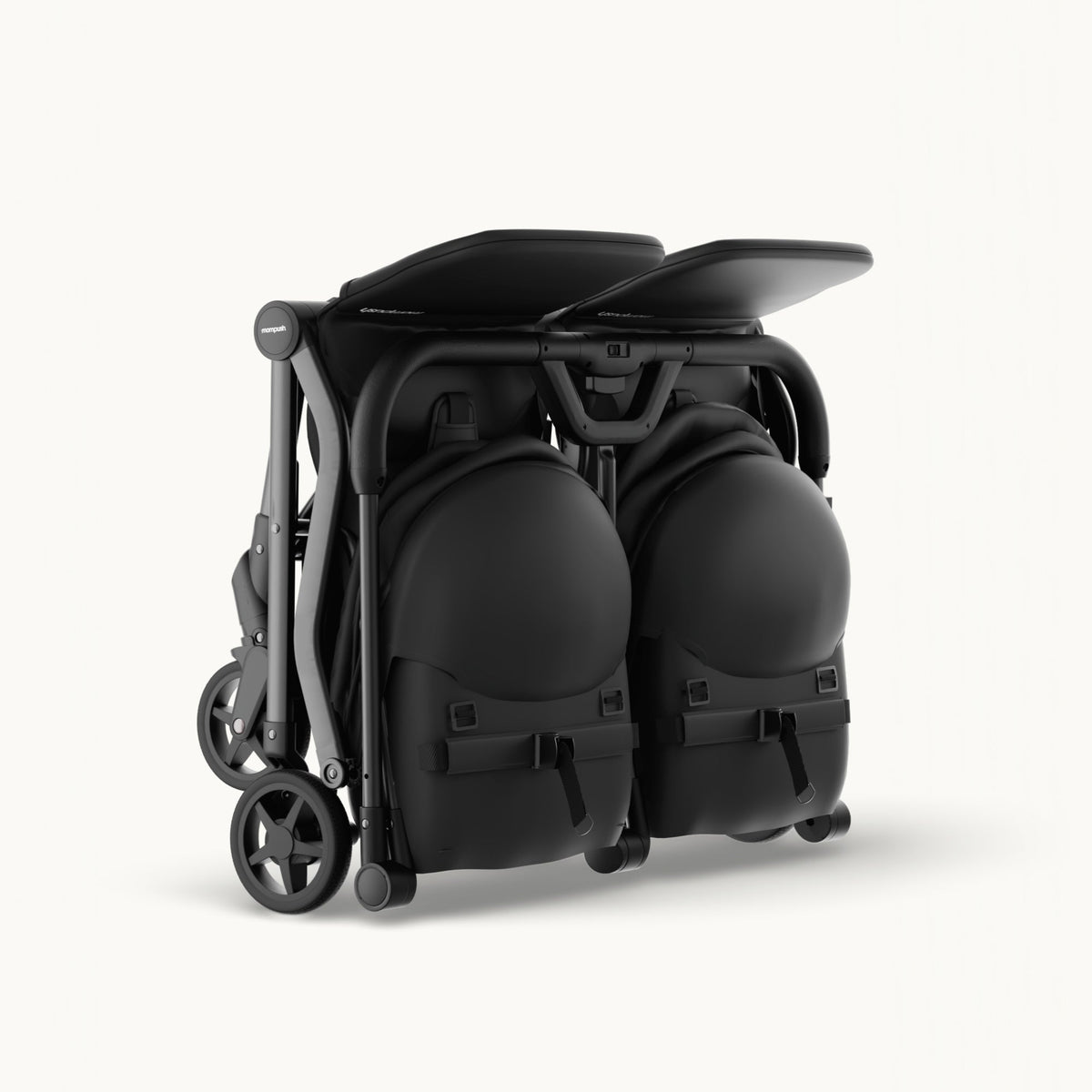 A black stroller shown folded and packed inside a matching black diaper bag, photographed on a clean off-white studio background.