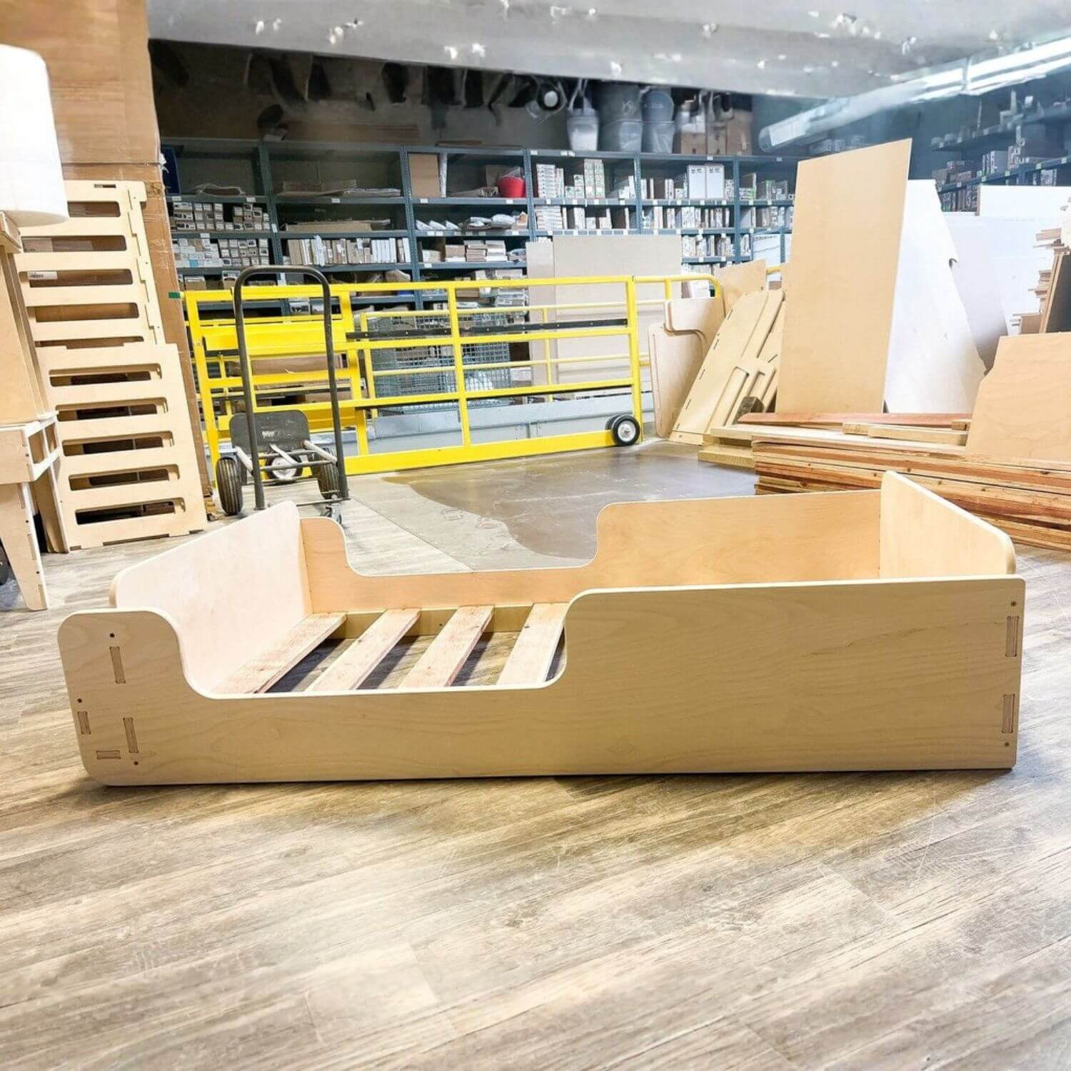 Bush Acres EVA- Floor Bed on a wooden floor with a warehouse background