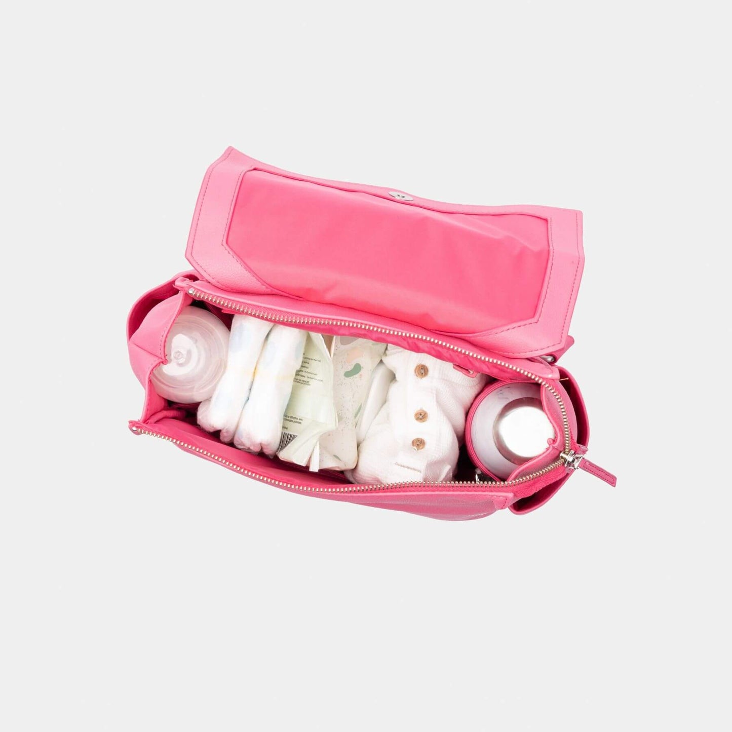 Freshly Picked Hot Pink Mini Classic Diaper Bag II with baby items