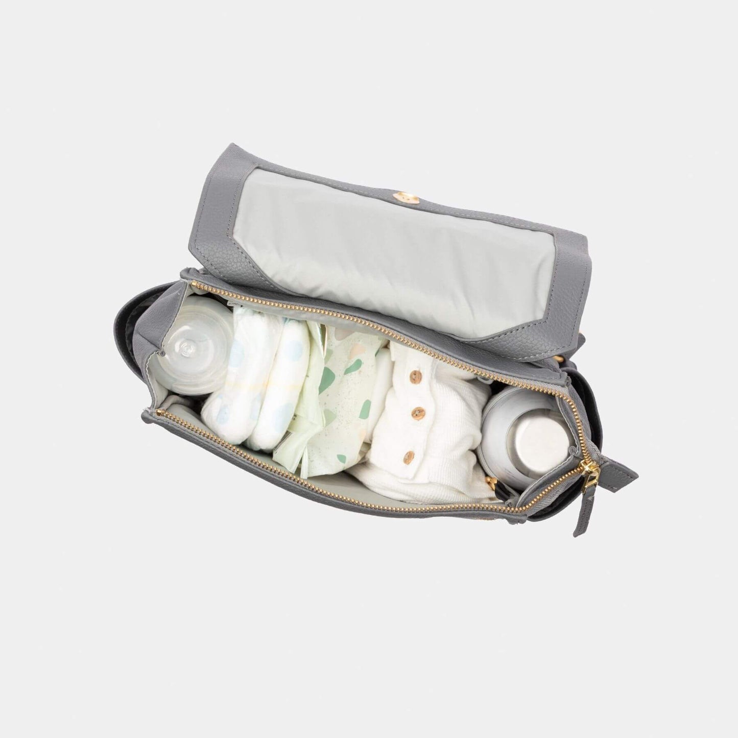 Freshly Picked Stone Mini Classic Diaper Bag II with bottles and diapers on a white background