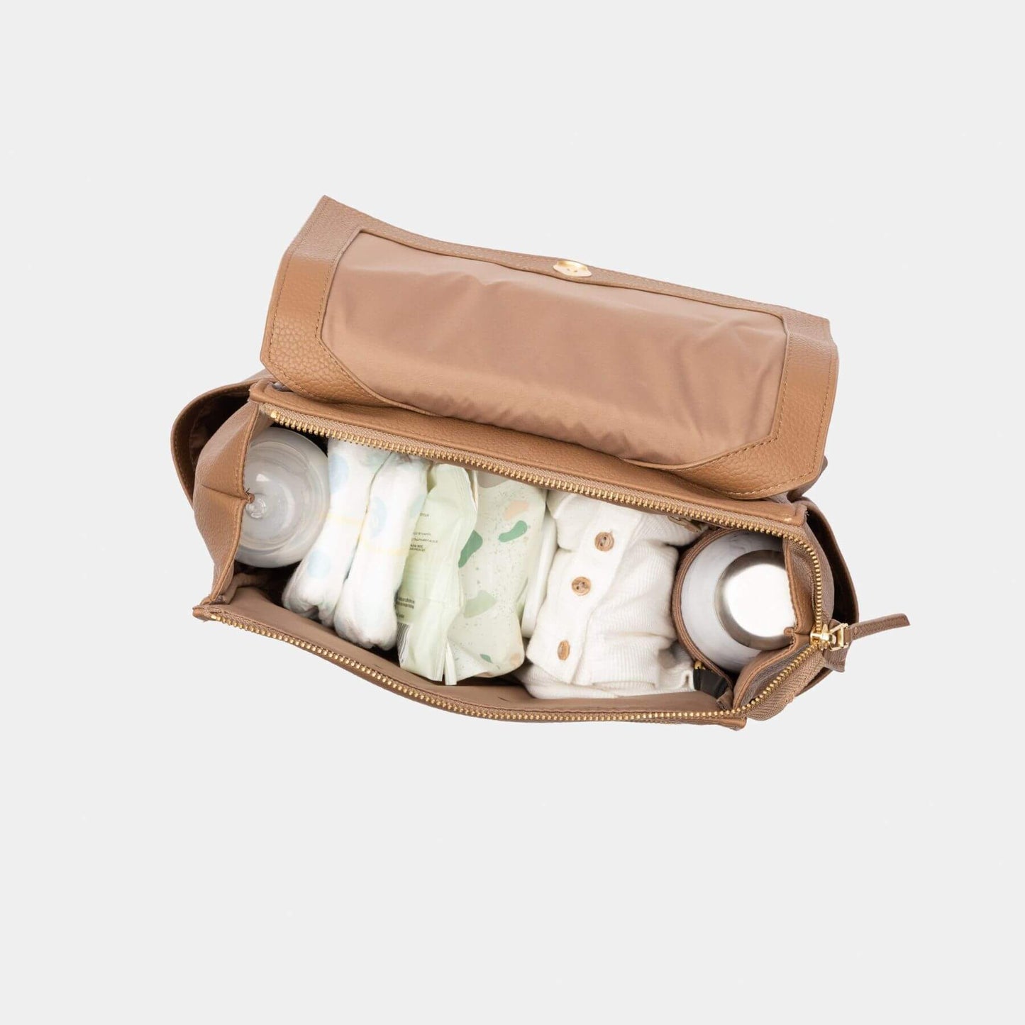 Brown diaper bag with baby items on a light gray background