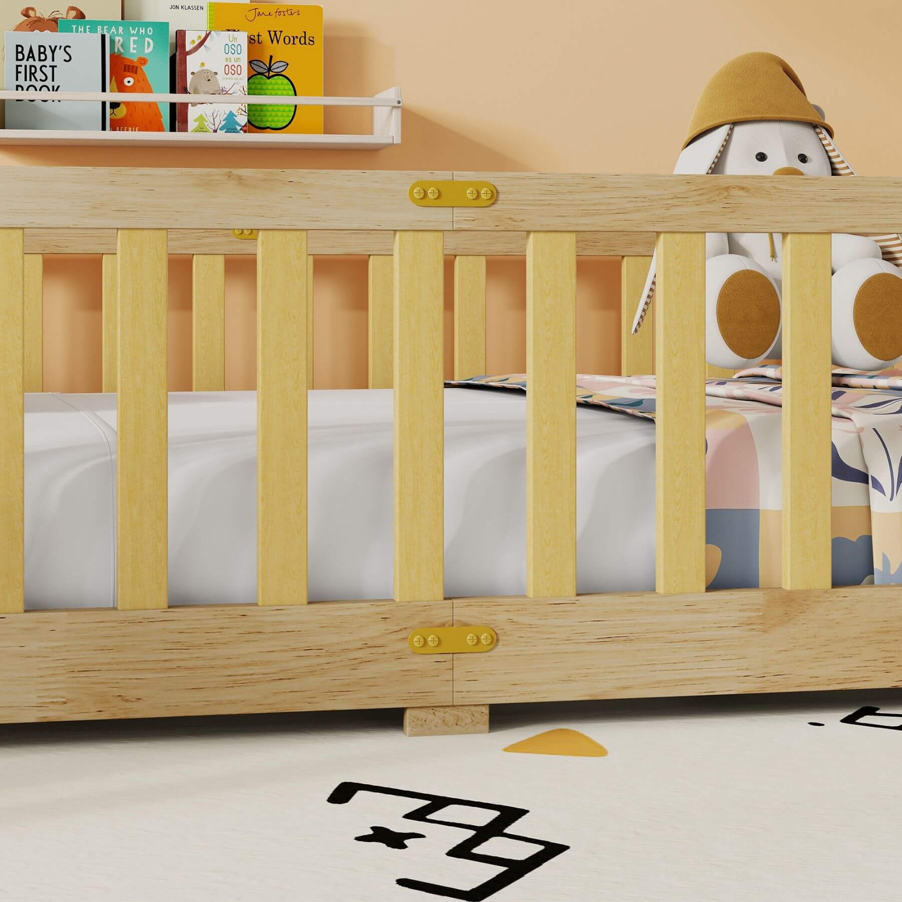 Inspirit Twin Size Floor Bed with Fence and Door - Natural with kids items including books and a toy on a light background