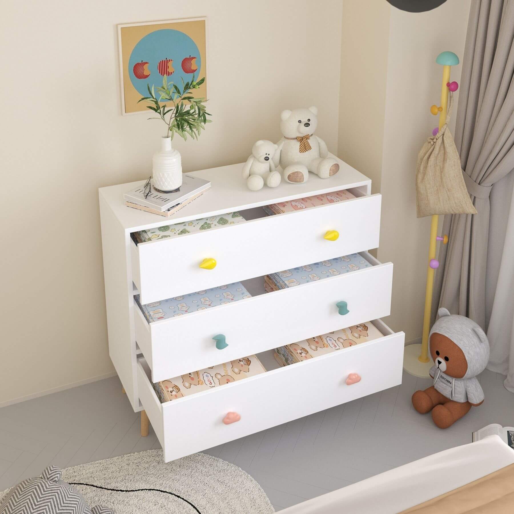 White dresser with colorful knobs in a child's room with teddy bears and decor.
