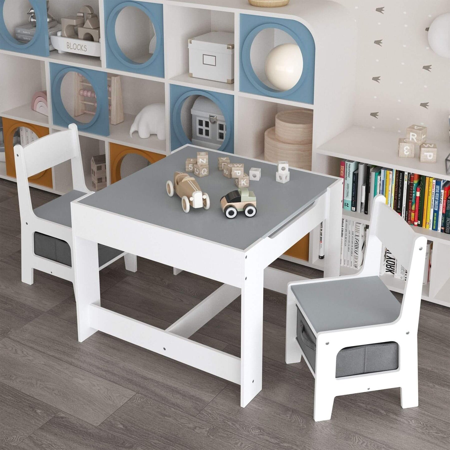 MOONRIVER 3-in-1 Wooden Activity Table - Gray with toys on a gray surface in a room with bookshelves.