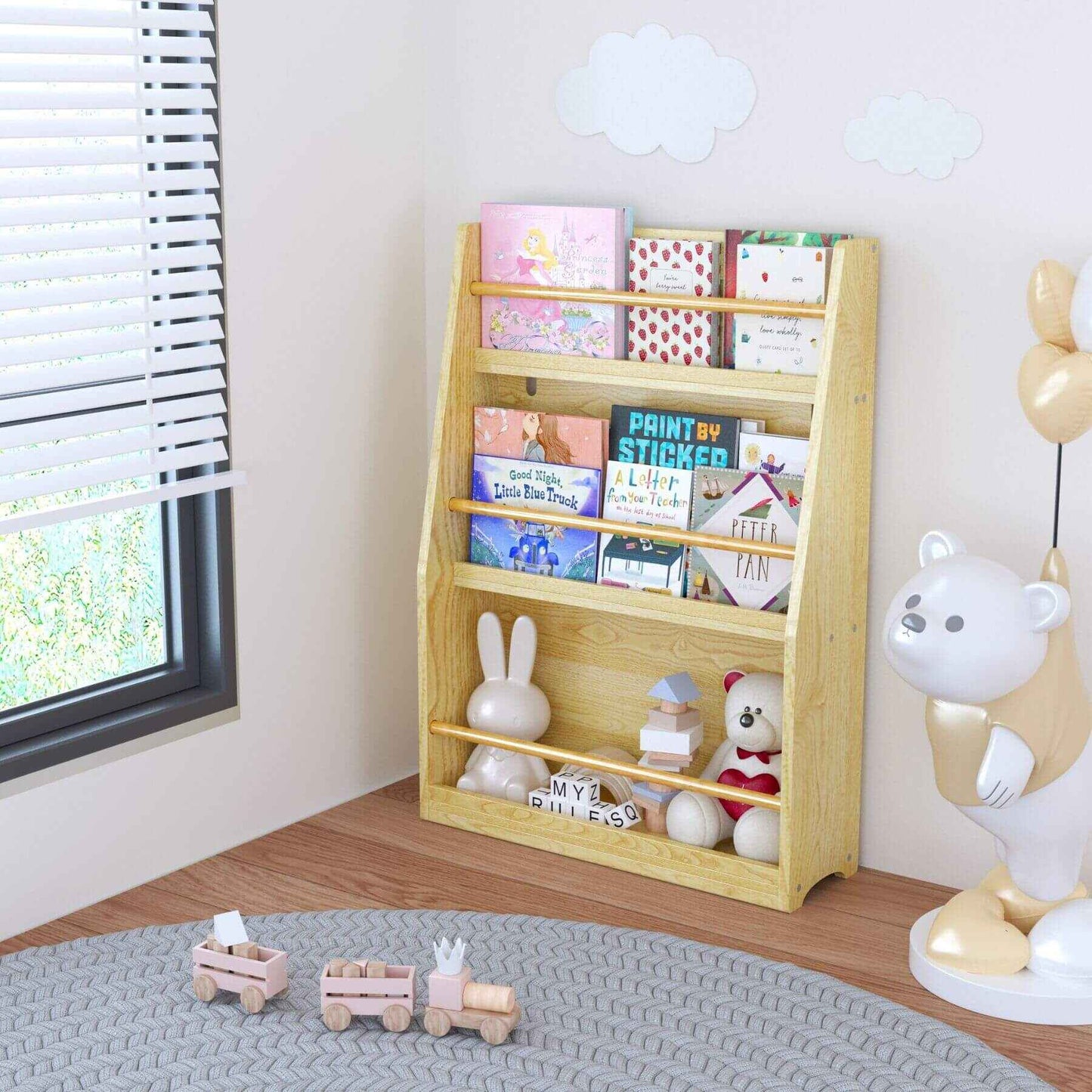 MOONRIVER 3 Tier Kids Book Shelf - Natural with children's books and toys in a room with a window and rug.