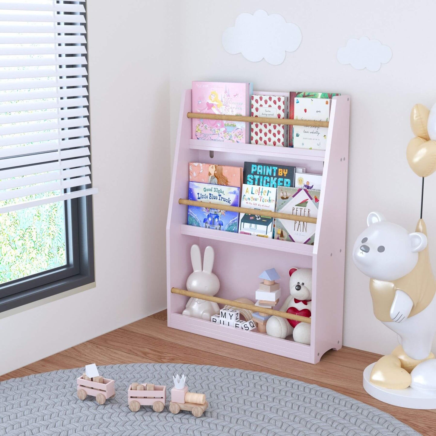 MOONRIVER 3 Tier Kids Book Shelf - Pink with books and toys in a room with a window and rug.