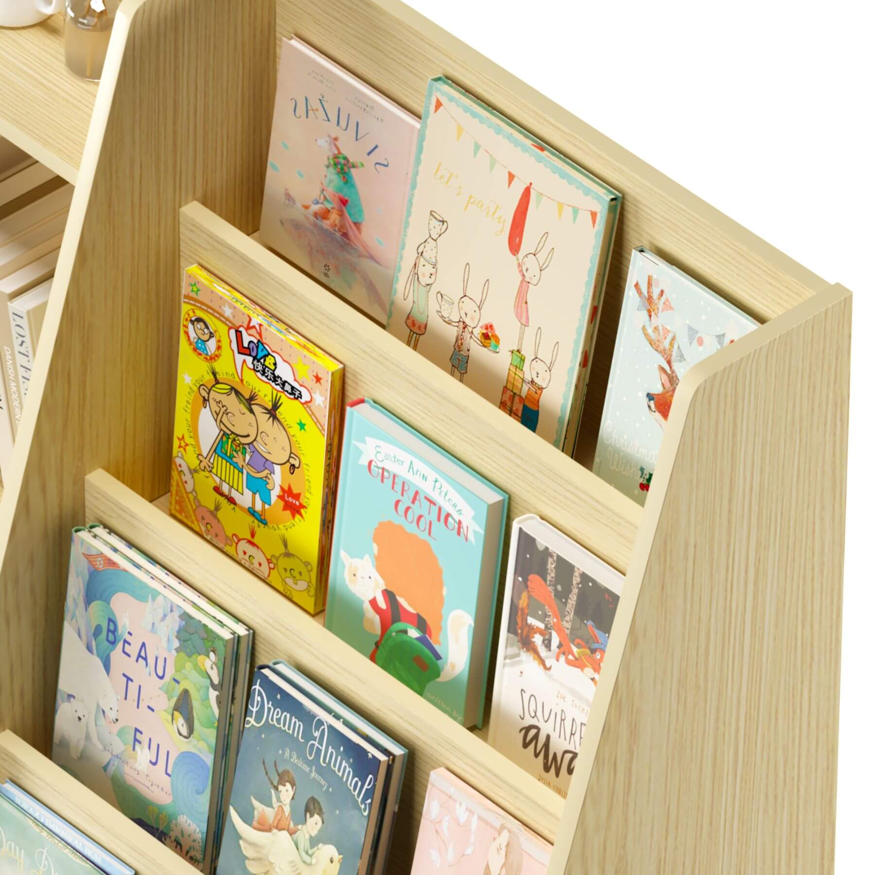 Children's books on a wooden bookshelf with a white background