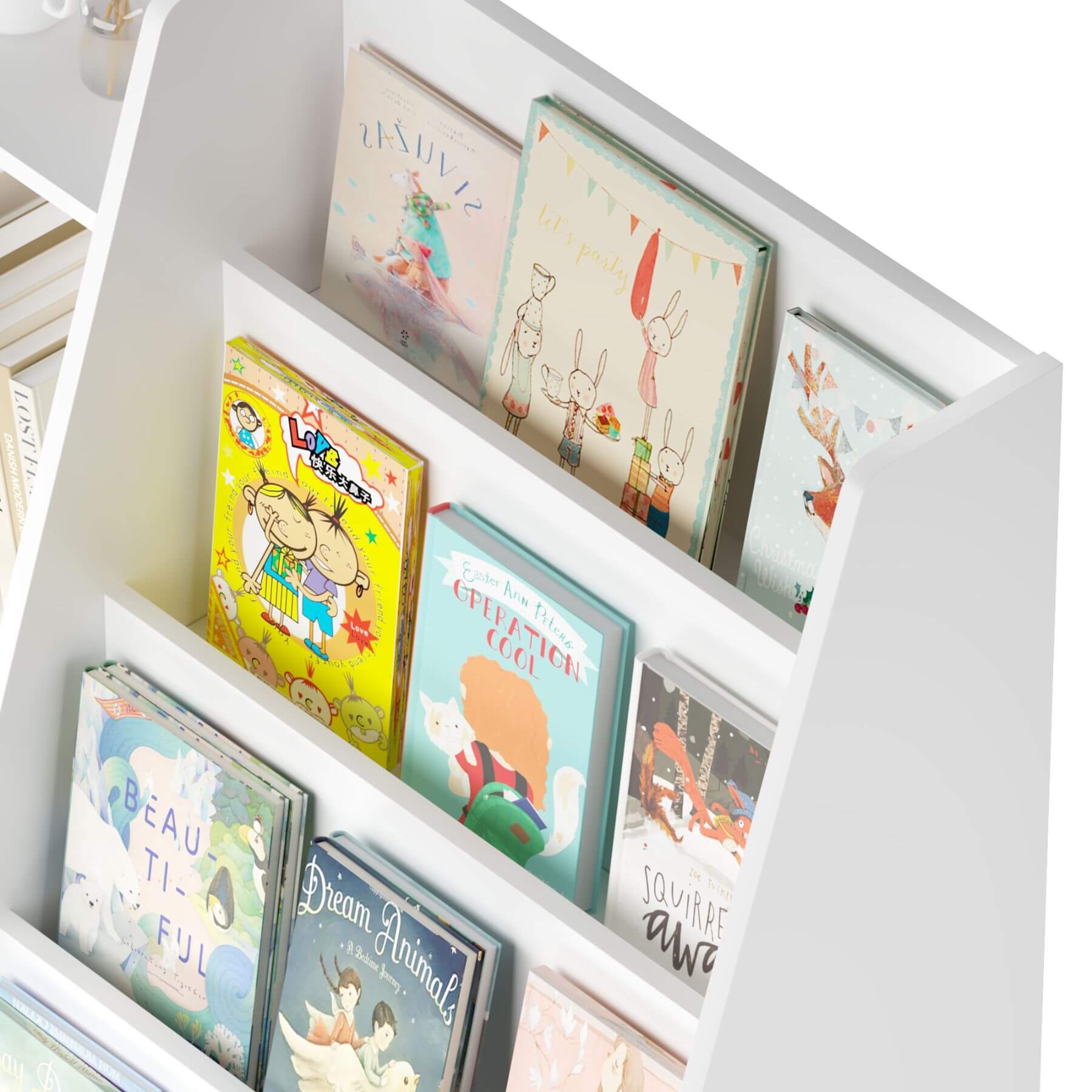 Children's books on a white bookshelf with a white background