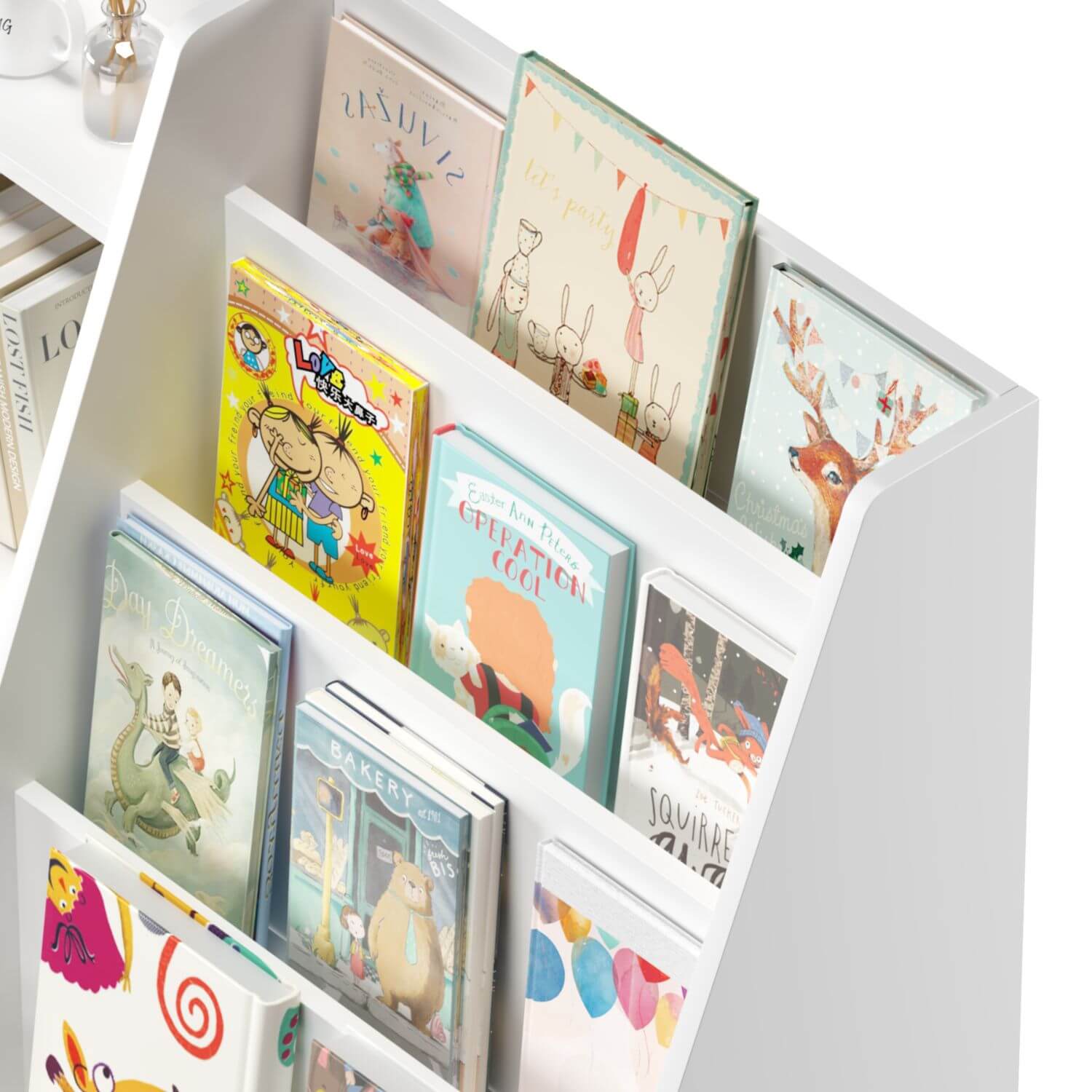 Children's books on a white bookshelf with a white background