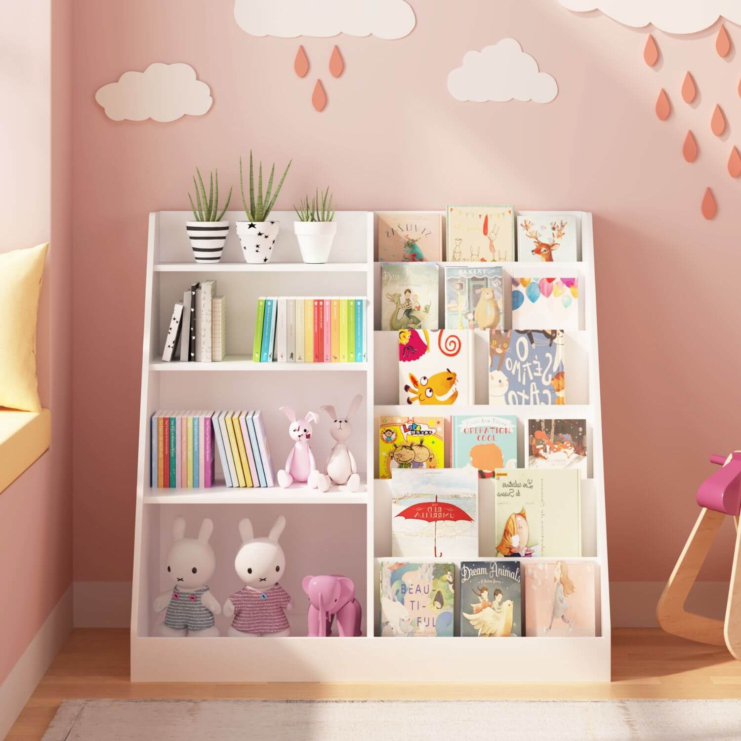 White bookshelf with children's books and toys against a pink wall with cloud and raindrop decorations.