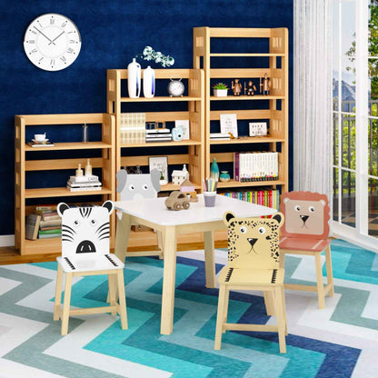 Children's playroom with wooden furniture, including MOONRIVER 5-Piece Kids Wood Table and Chair Set with animal faces, against a blue wall.