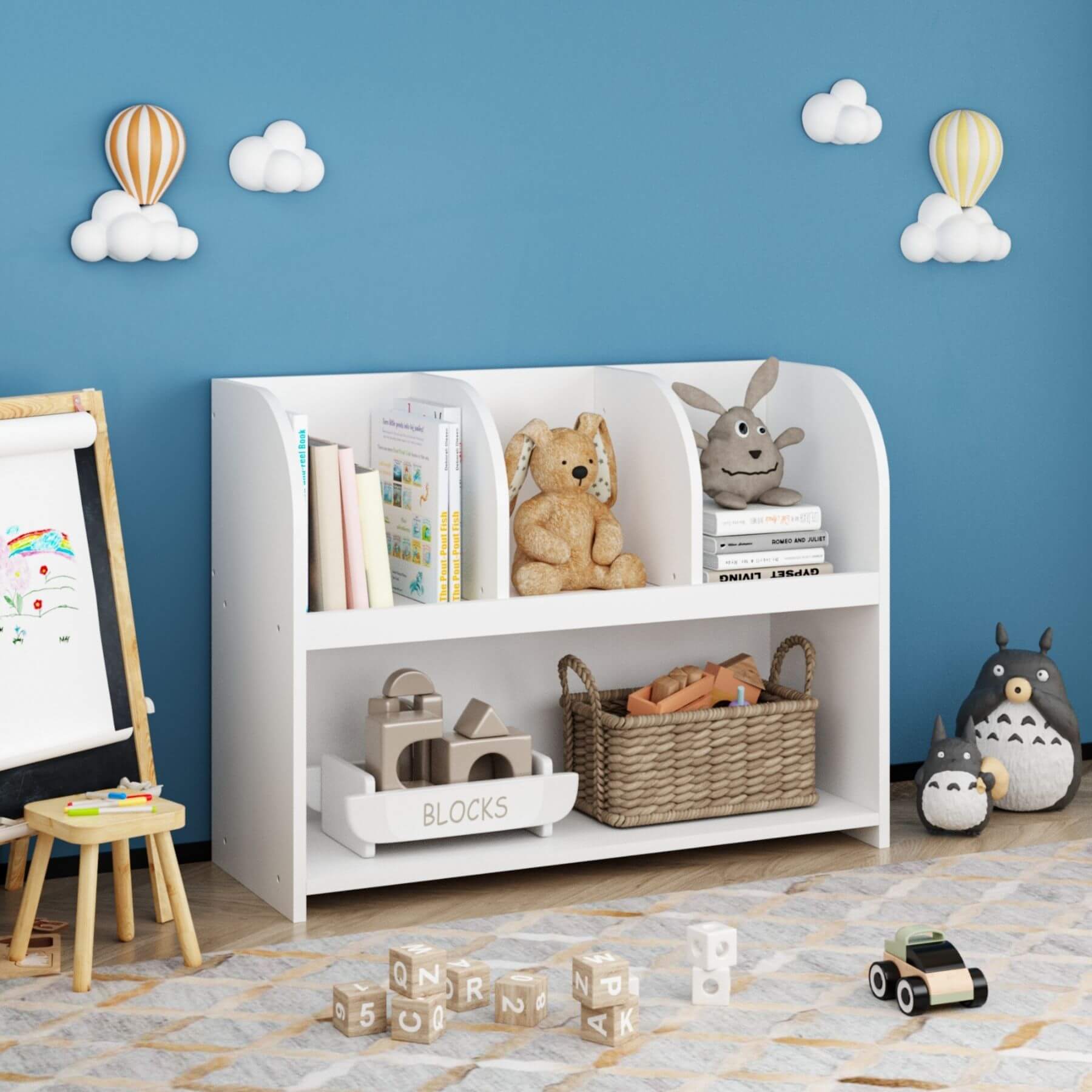 MOONRIVER Kids Bookcase with 4 Compartments - White with toys against a blue wall with cloud and hot air balloon decorations.
